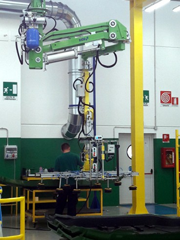 handling-tractor-sides Handling large tractor sides in a production line using an overhead mounted intelligent lift assist device INDEVA Liftronic Air