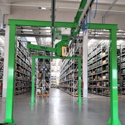overhead mounted manipulator arm- Articulated arm sliding under overhead rails mounted on a  bridgecrane structure
